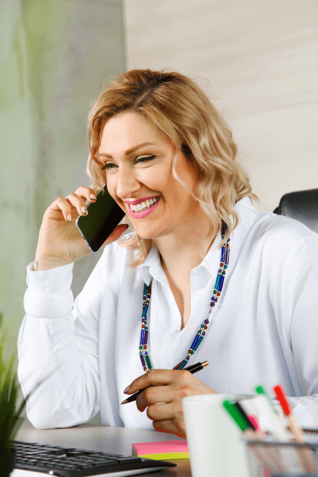 women talking on the phone and smiling